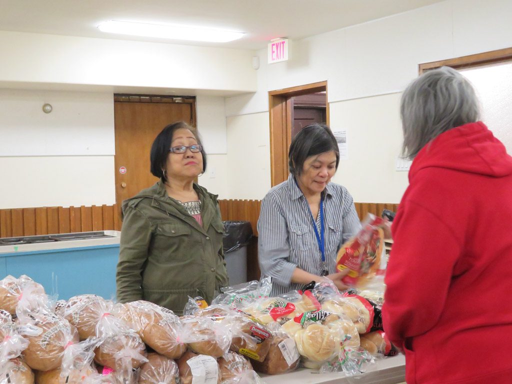 Knox Foodbank distribution 2 women and guest 2019 smaller for website